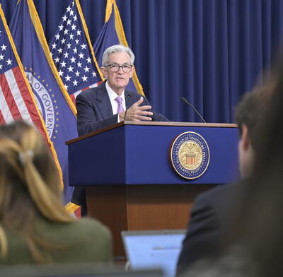 Fed Chair Jerome Powell speaks at the lectern