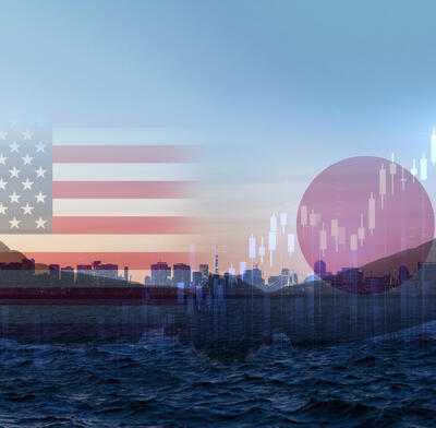 US & Japan flags against Tokyo backdrop and chart pattern